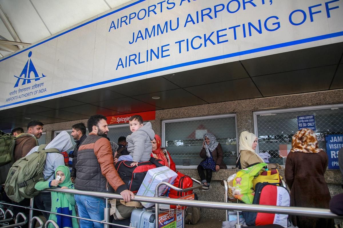 Passengers stranded outside the Jammu airport after it was closed for civilian operations amid tension along the Pakistan border. ( PTI Photo)