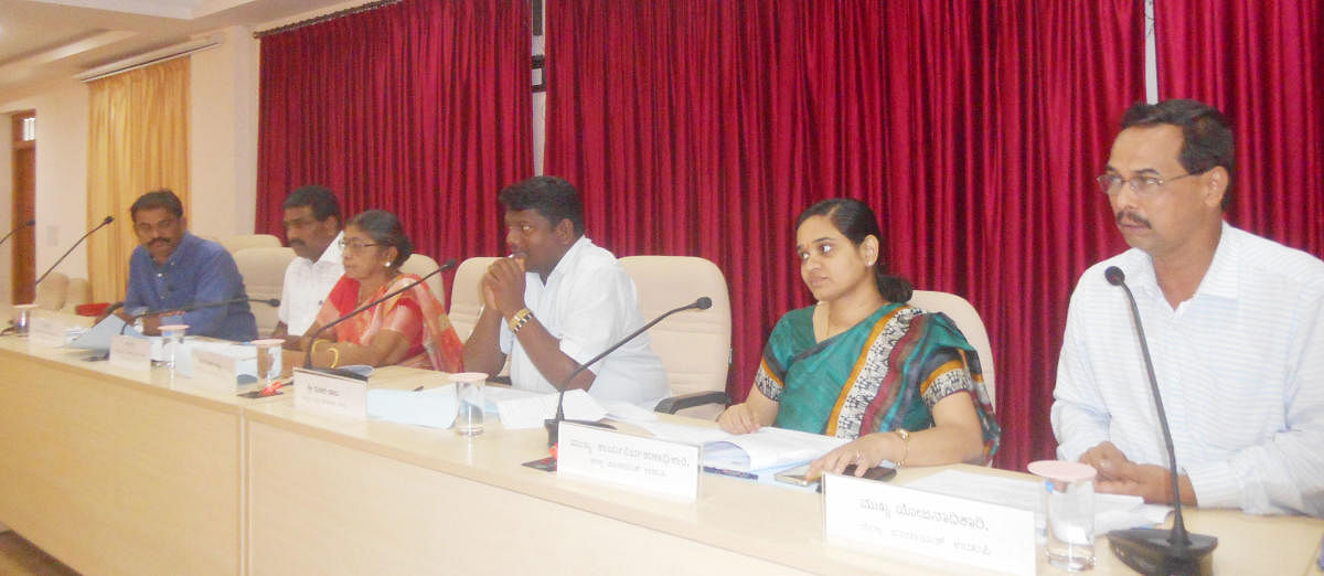 Zilla Panchayat President Dinaker Babu speaks at Karnataka Development Programme review meeting held in Udupi on Wednesday. 