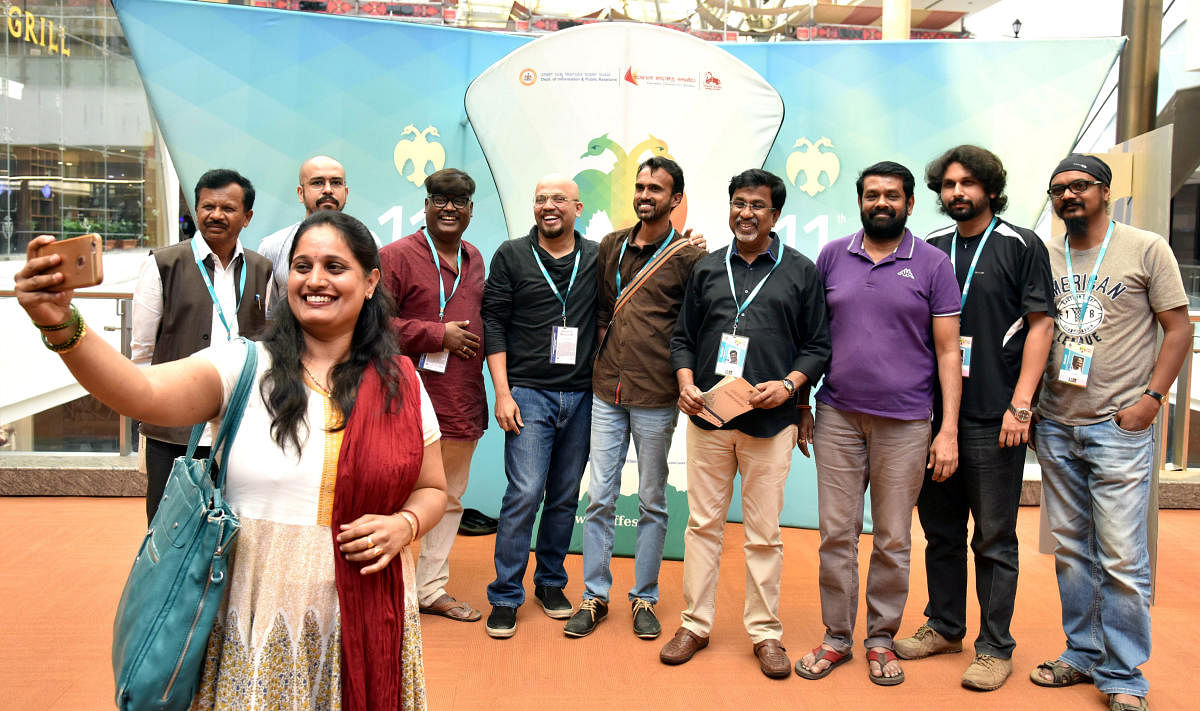 Director Champa Shetty takes a selfie with filmmakers at 11th Bengaluru International Film Festival in the city on Wednesday. DH Photo/S K Dinesh