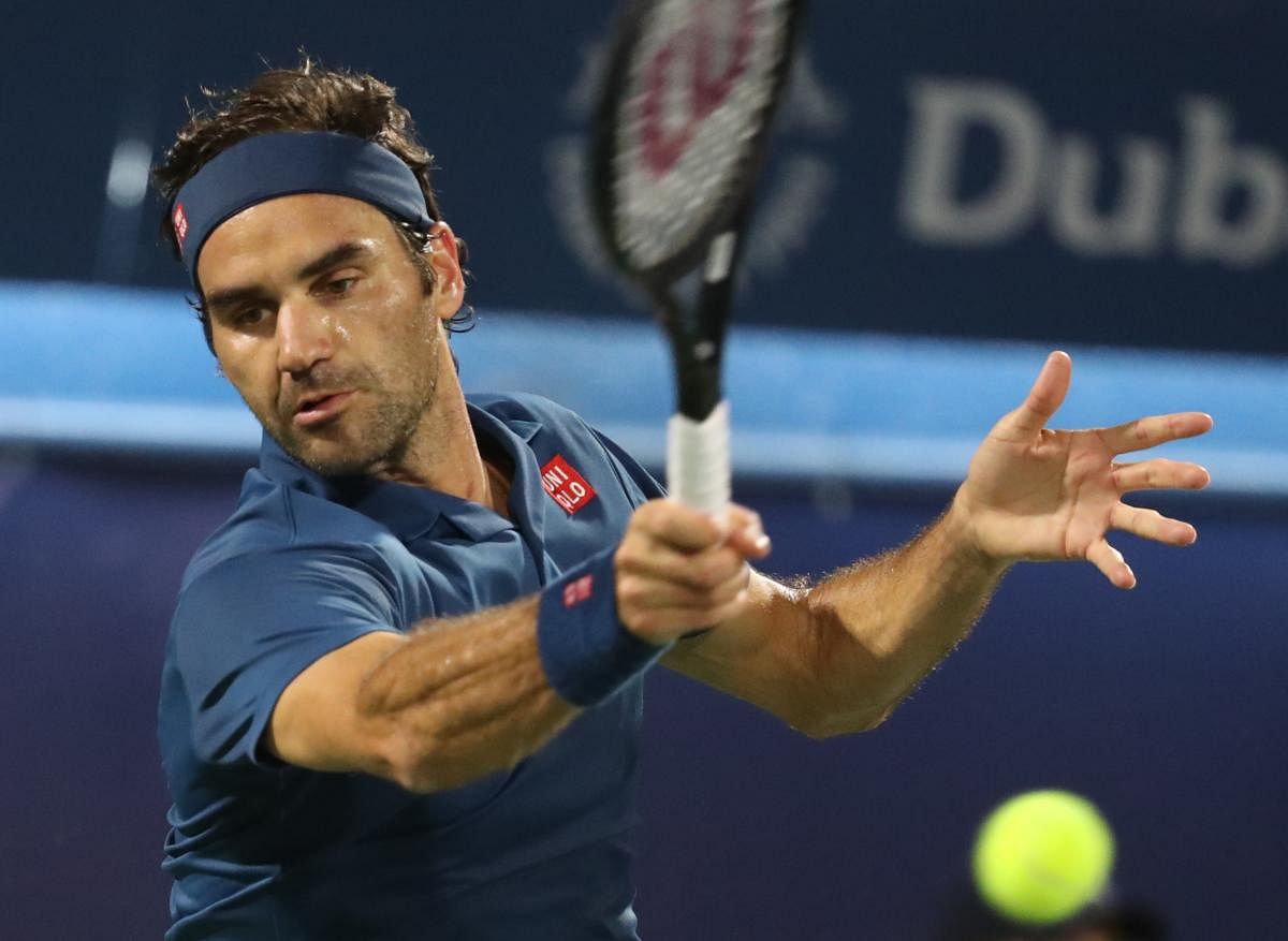 CLASSY: Swiss great Roger Federer returns during his win over Hungarian Marton Fucsovics. AFP
