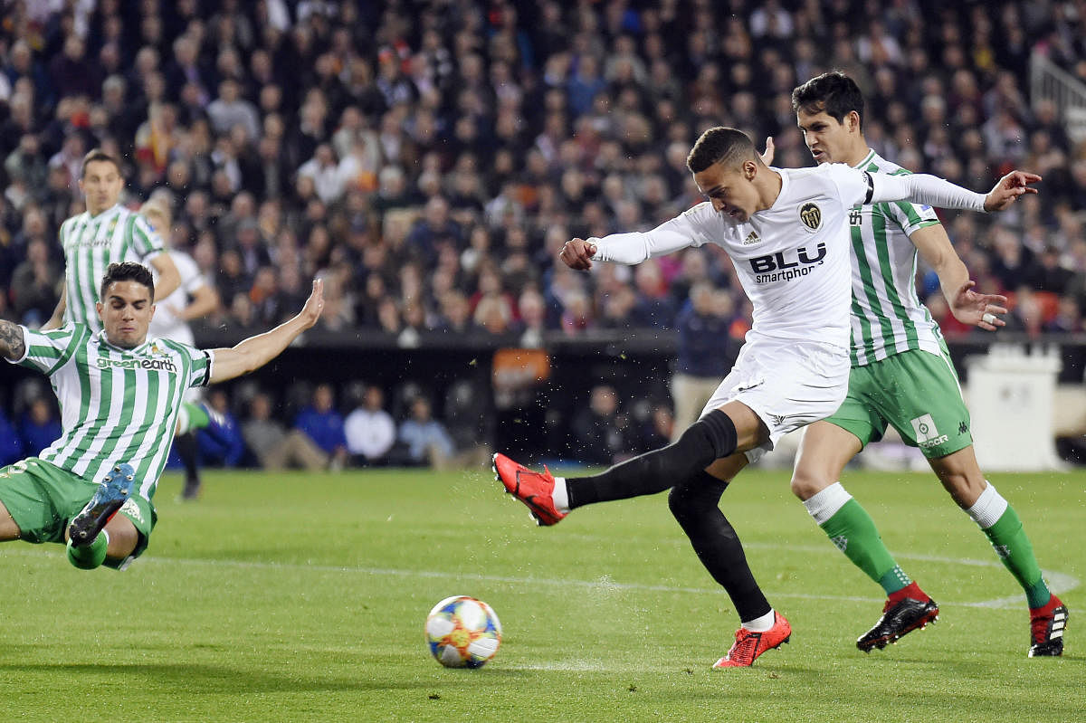 Valencia's Rodrigo Moreno (centre) fires a shot at Real Betis' goal during their Copa del Rey semifinal second leg at the Mestalla stadium in Valencia on Thursday. AFP