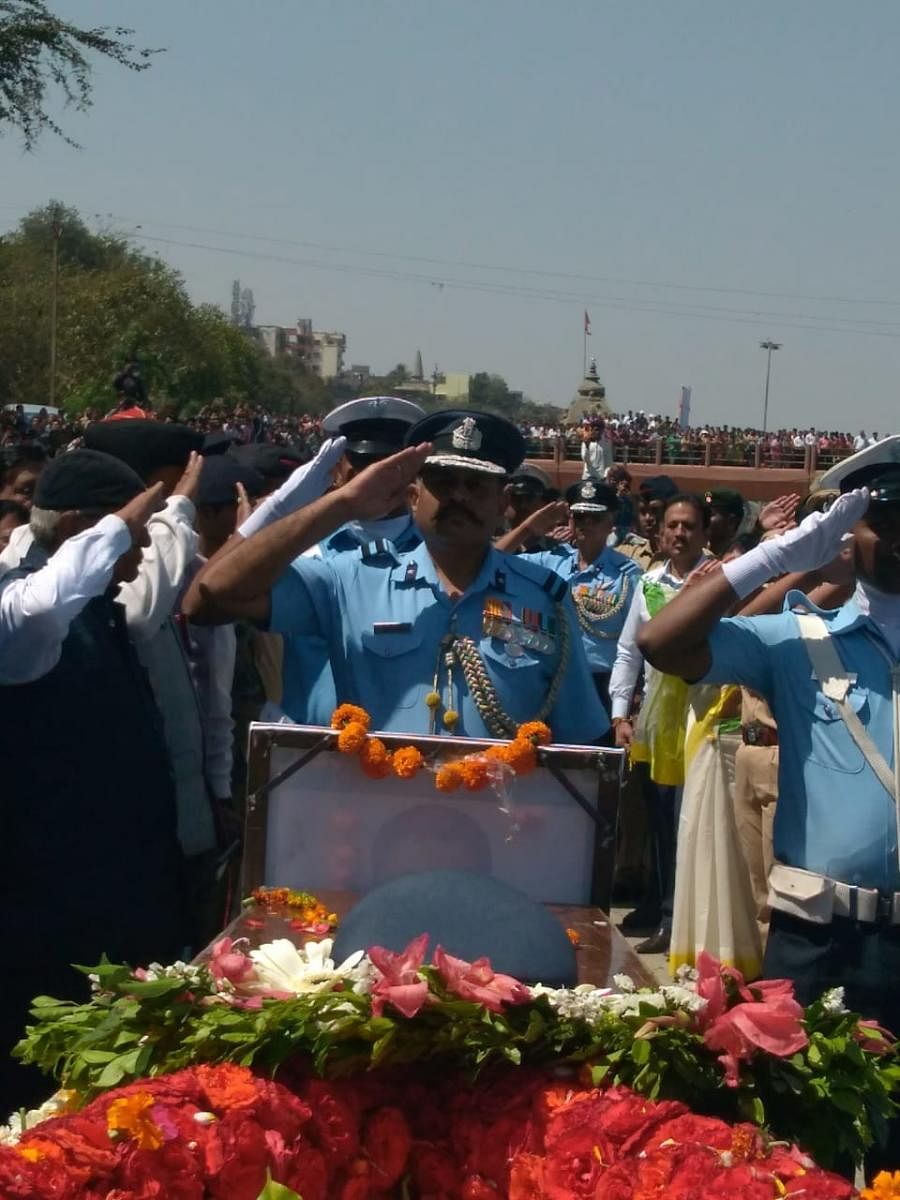 Officials salute IAF pilot Sqn Ldr Ninad Mandavgane during his funeral ceremony in Nashik.