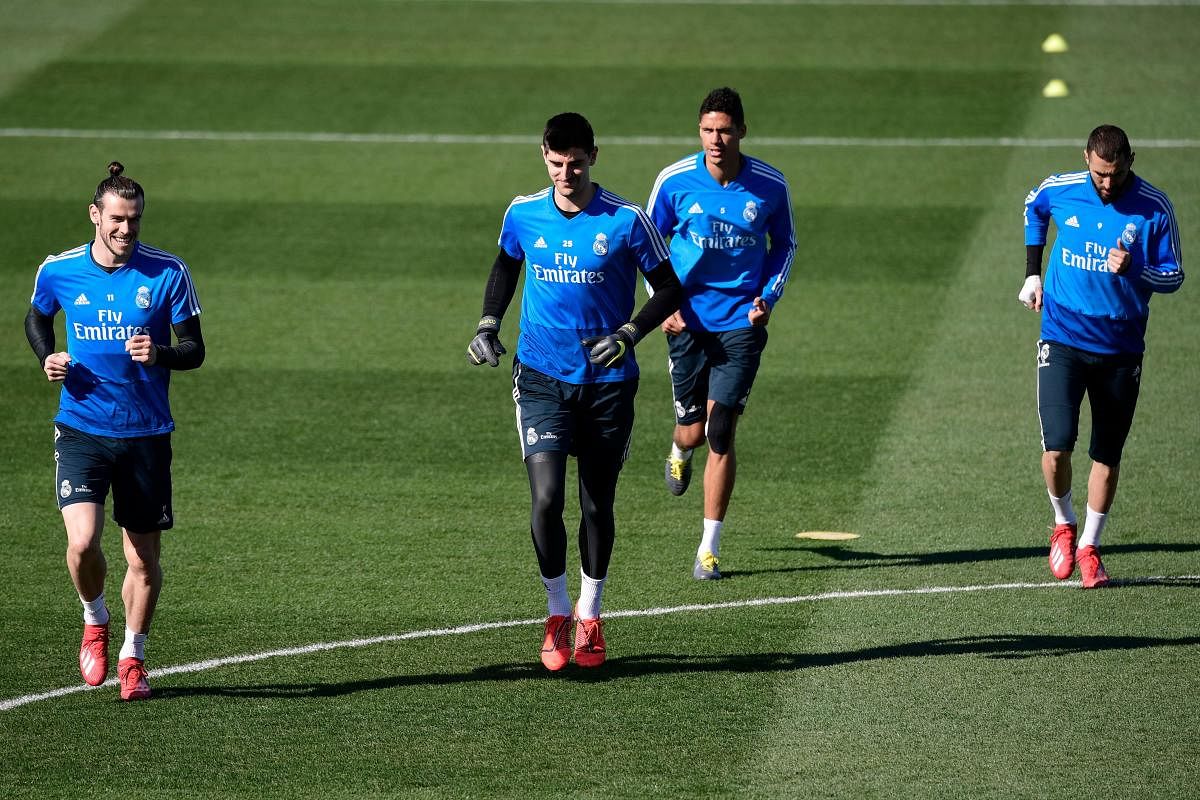 TOUGH TASK Real Madrid forward Gareth Bale (from left), goalkeeper Thibaut Courtois, defender Raphael Varane and forward Karim Benzema during a training session in Madrid on Friday. AFP
