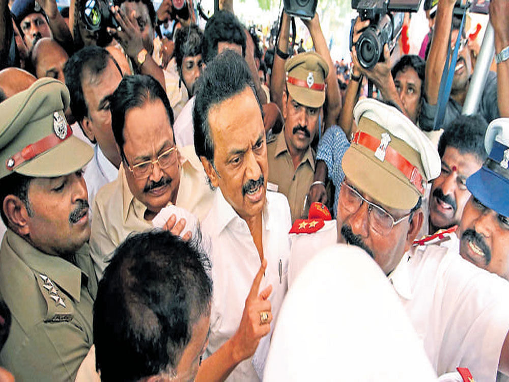 DMK leader M K Stalin argues with security personnel outside the Tamil Nadu Assembly in Chennai on Thursday.