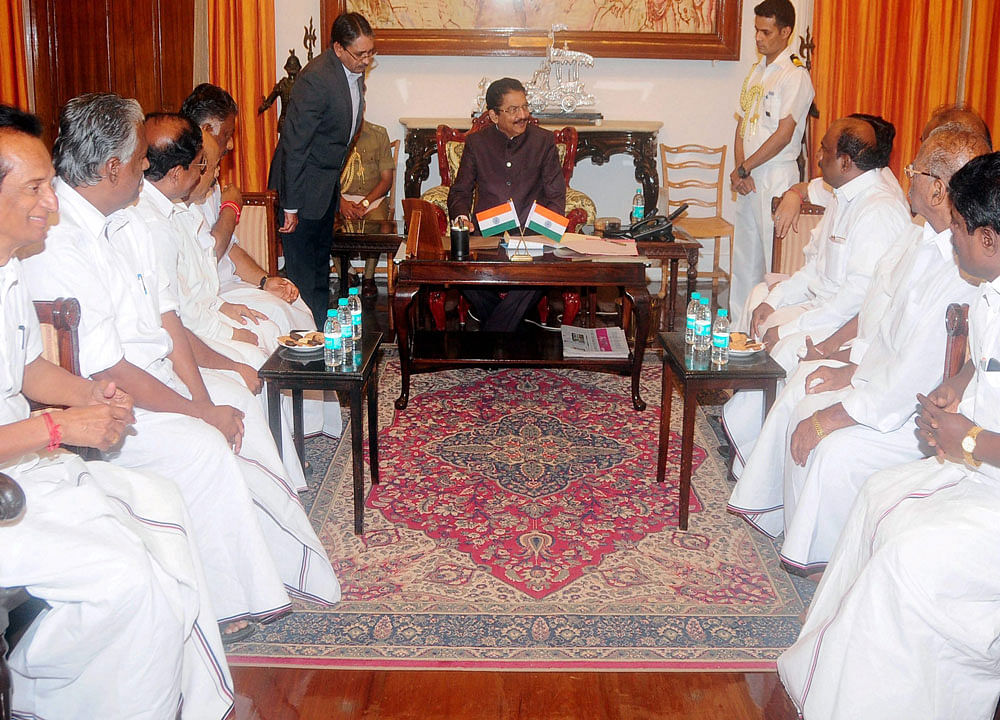 Tamil Nadu Chief Minister O Panneerselvam with supporting MLAs meets with Governor at Raj Bhavan in Chennai on Wednesday. PTI Photo