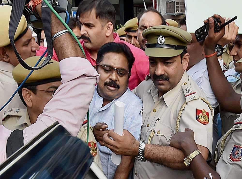 AIADMK leader TTV Dhinakaran after being produced in Tis Hazari court in New Delhi on Wednesday. PTI photo