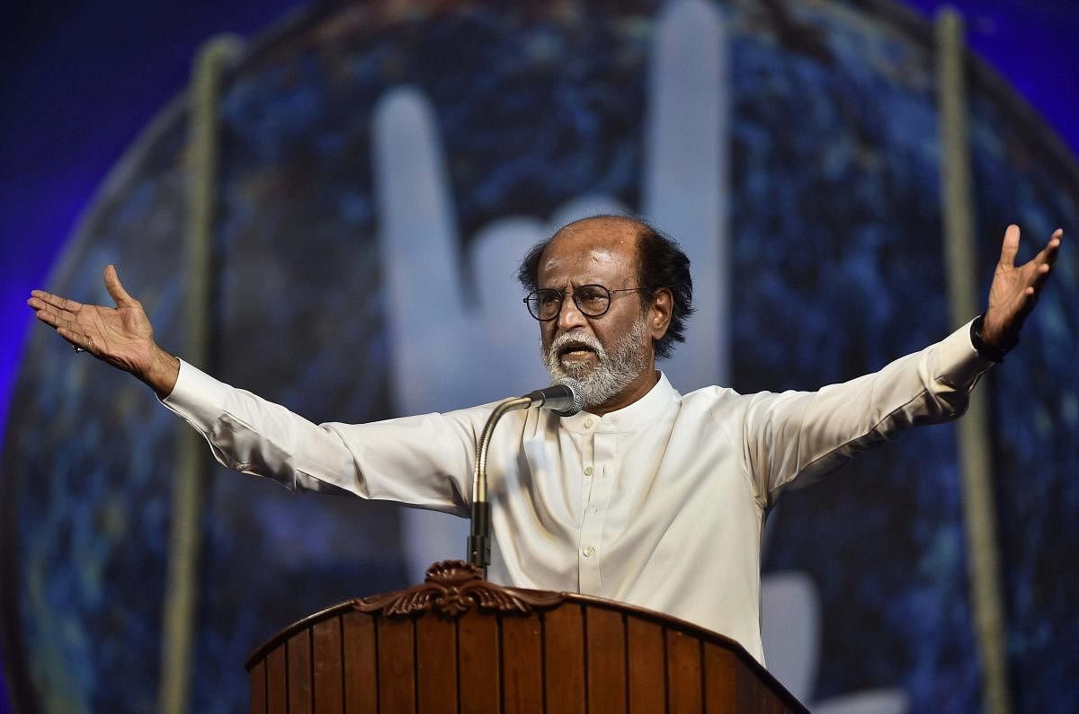 Tamil actor Rajinikanth gestures while announcing his political entry, on the final day of a six-day-long photo session with fans, in Chennai on Sunday. The announcement ended years of speculation about his joining of politics. PTI Photo