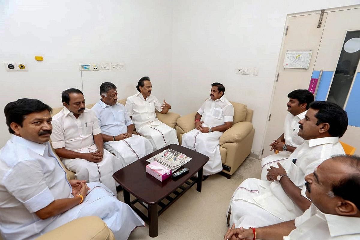 Tamil Nadu Chief Minister Edappadi K Palaniswami, Deputy Chief Minister O Panneerselvam and other AIADMK leaders meet DMK working president M K Stalin to inquire about his father and party chief M Karunanidhi's health at Kauvery hospital, in Chennai on Mo