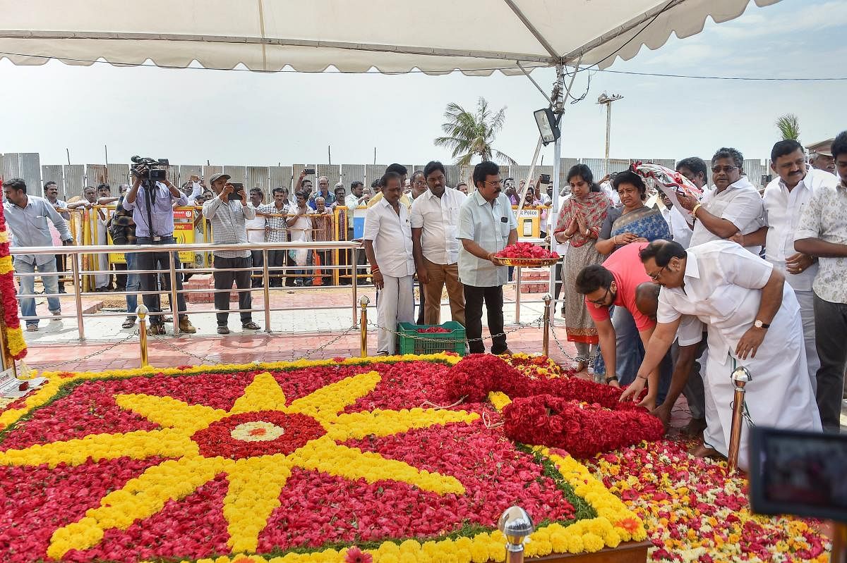 Former union minister MK Alagiri and his family members pay homage to late father and DMK patriarch M Karunanidhi at his memorial on Marina Beach, in Chennai. PTI photo