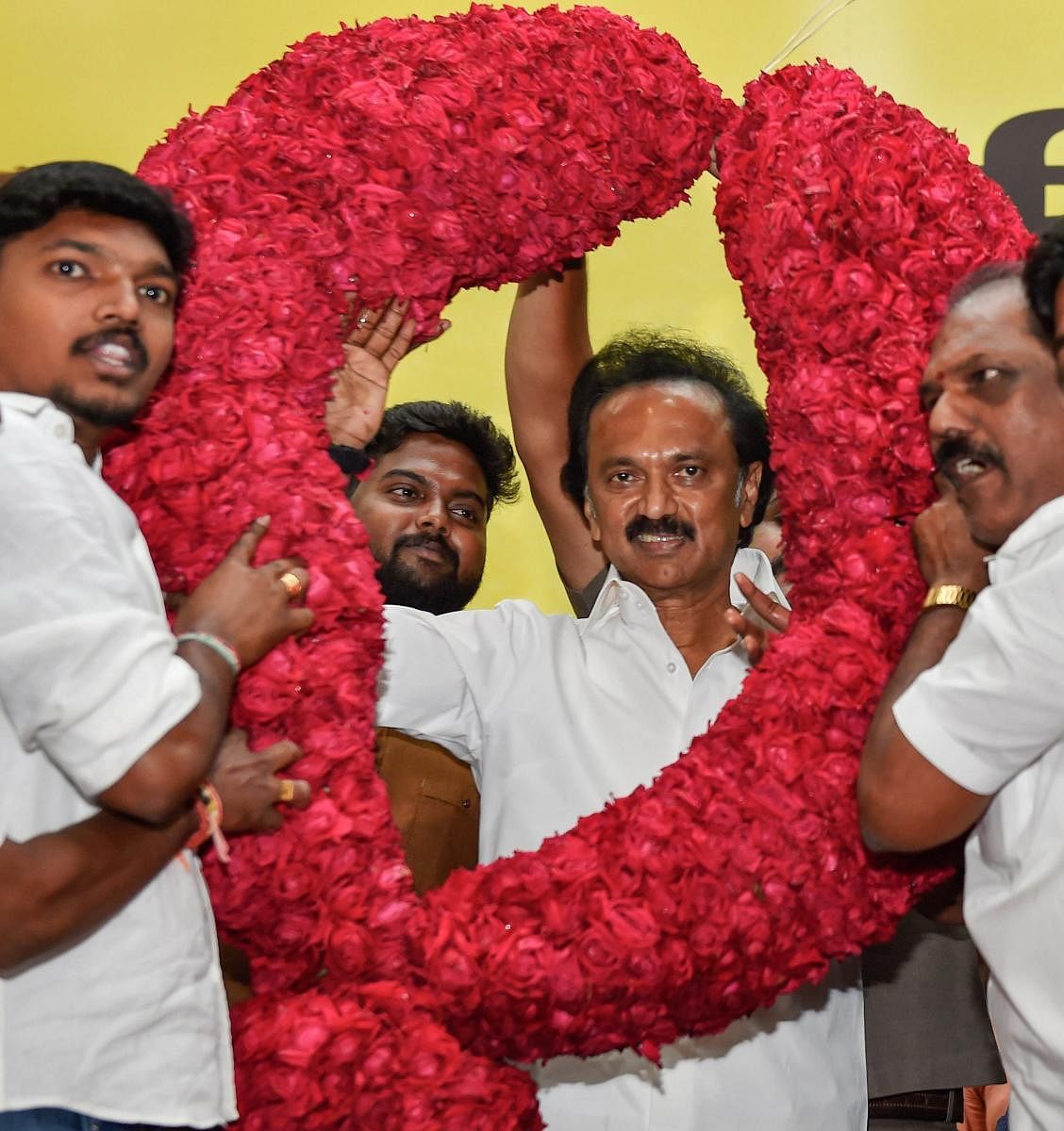 DMK supporters garland M K Stalin as the newly elected party president at a function held at Anna Arivalayam in Chennai on Tuesday. PTI