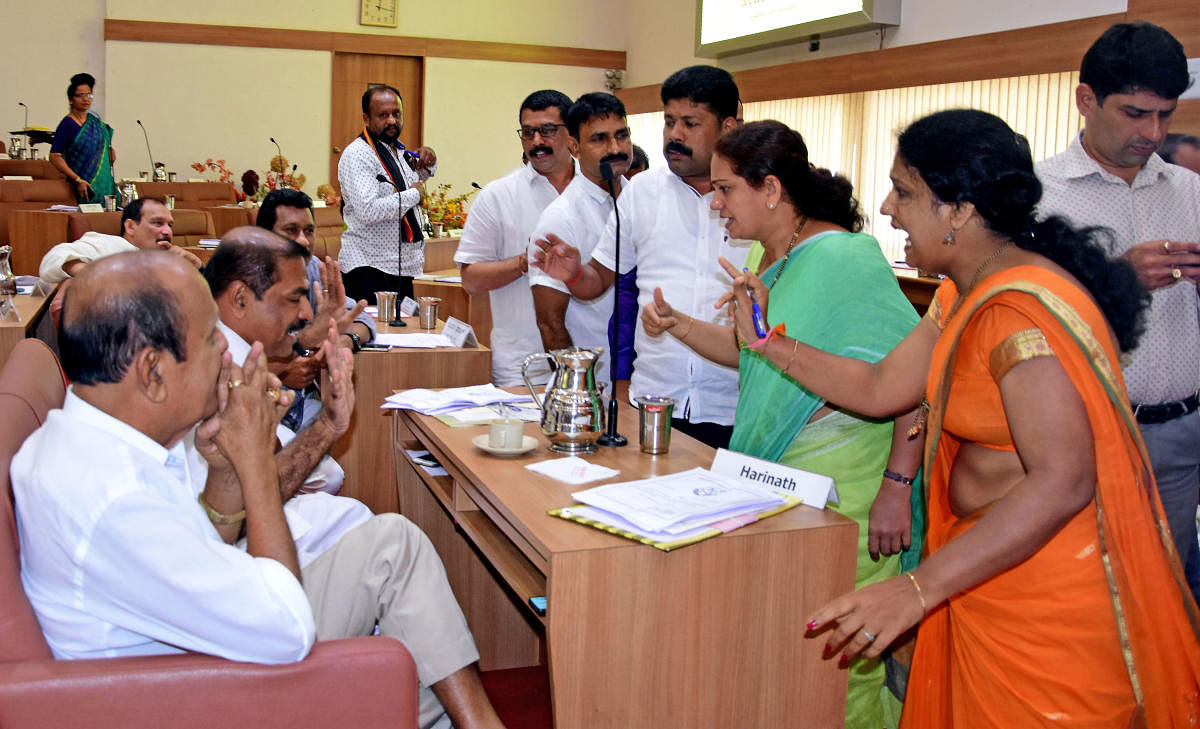 Opposition members take Shashidhar Hegde, Chief Whip of the Mangaluru City Corporation Council, to task during the monthly council meeting in Mangaluru on Wednesday.