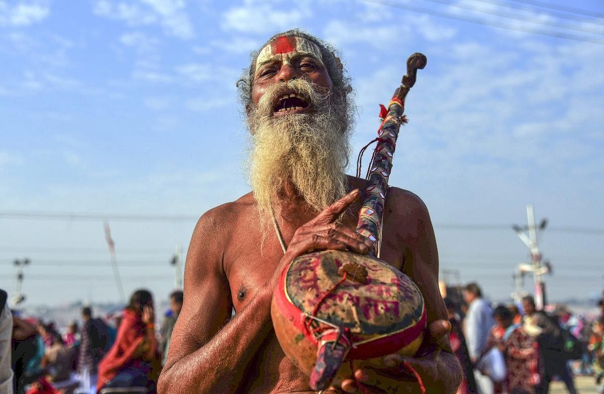 Allahabad: A sadhu chants hymns after taking a holy dip at Sangam on the auspicious 'Maghi Purnima' day during the Kumbh Mela, or pitcher festival, in Allahabad (Prayagraj), Tuesday, Feb. 19, 2019. (PTI Photo) (PTI2_19_2019_000021B)