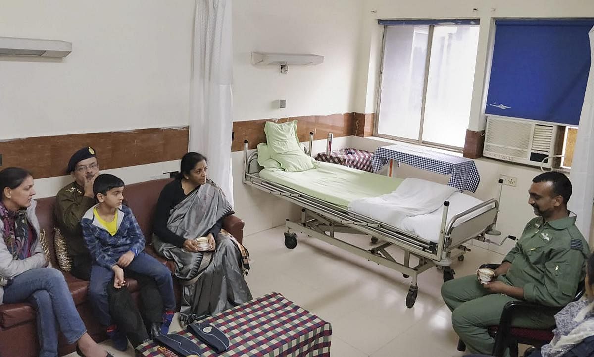 Union Defence Minister Nirmala Sitharaman meets Indian Air Force Wing Commander Abhinandan Varthaman at Army's R R hospital, who was captured by Pakistan during aerial combat, in New Delhi, on Saturday. PTI