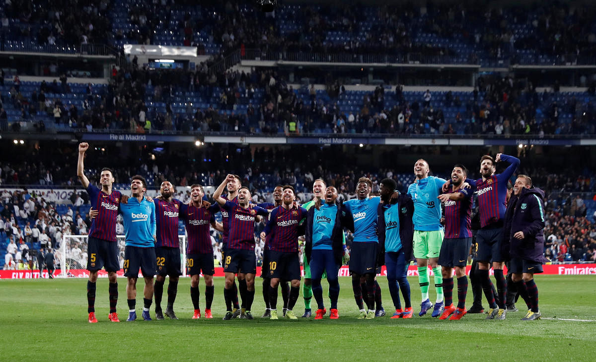 After knocking Real out of the Copa del Rey on Wednesday, Barca returned to the Santiago Bernabeu for a 1-0 victory that surely eliminates their greatest rivals from the title race too. (Reuters Photo)