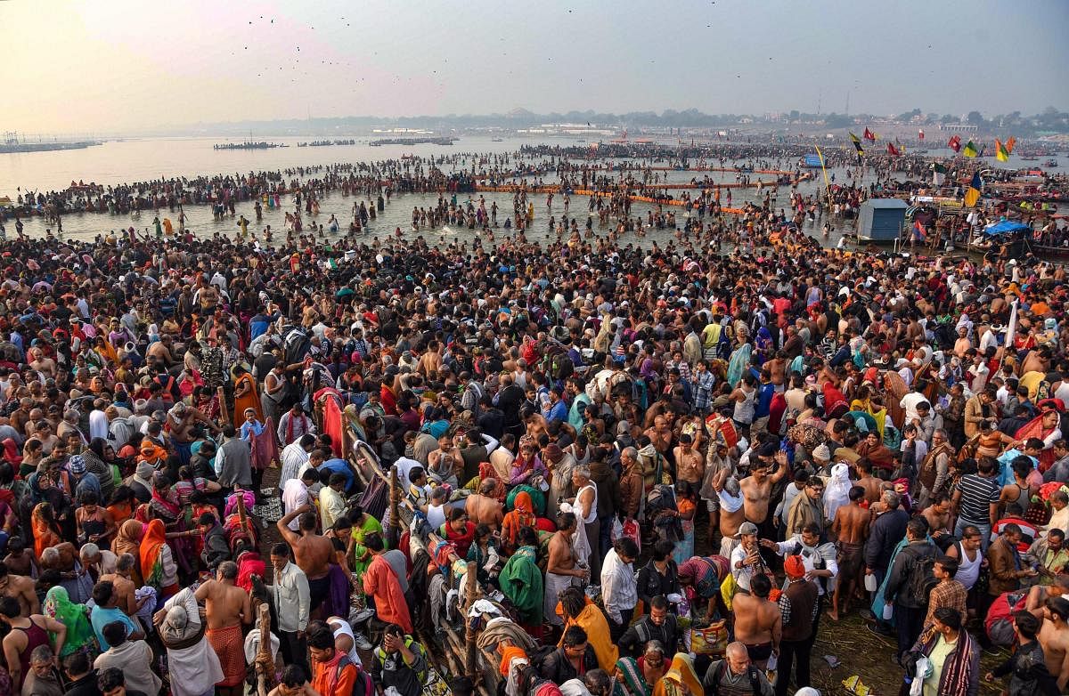 Devotees offer prayer and take holy dip on the occasion of 'Maha Shivaratri' festival during the ongoing Kumbh Mela, in Prayagraj (Allahabad), Monday, March 4, 2019. (PTI Photo) 