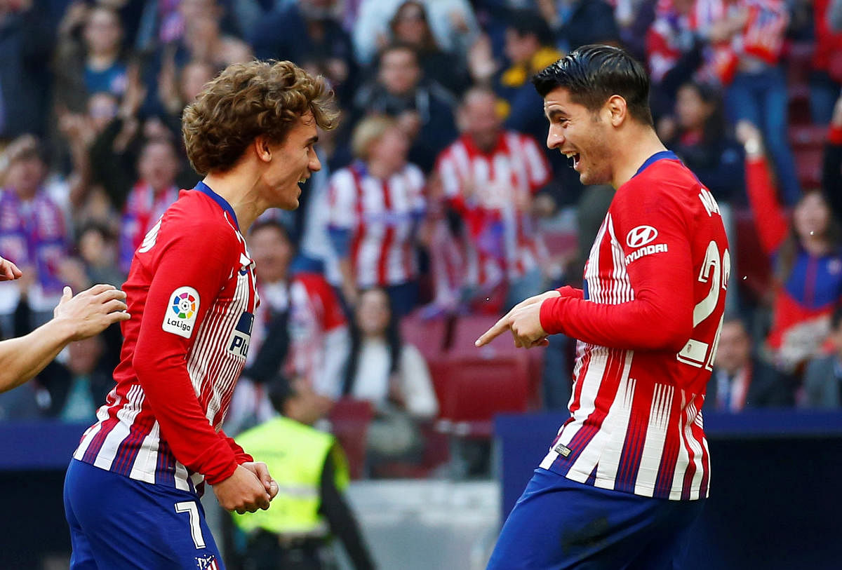 THRILLED: Atletico Madrid's Alvaro Morata (right) celebrates his team's first goal with Antoine Griezmann. Reuters