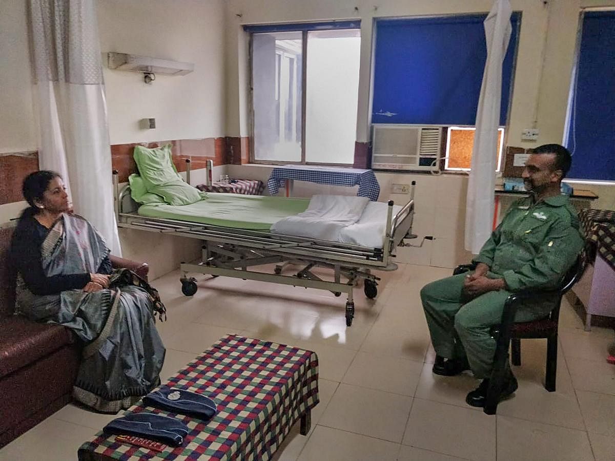New Delhi: Union Defence Minister Nirmala Sitharaman meets Indian Air Force Wing Commander Abhinandan Varthaman at Army's R.R. hospital, who was captured by Pakistan during an aerial combat, in New Delhi, Saturday, March 2, 2019. (PTI Photo) (PTI3_2_2019_