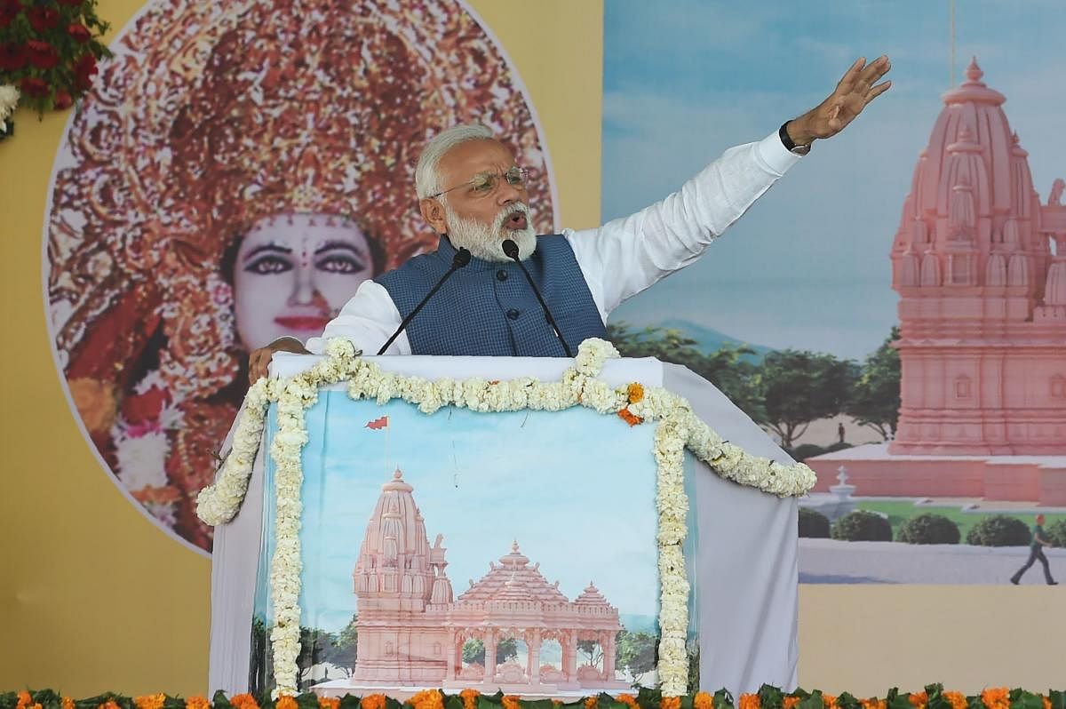 Indian Prime Minister Narendra Modi speaks during the inauguration of the 'Annapurnadham', a Panch Tatva temple, in Adalaj, some 30 kms from Ahmedabad on Tuesday. (AFP Photo)
