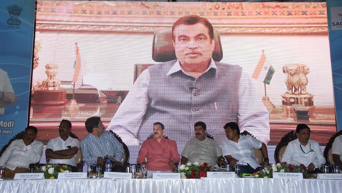 Union Minister for Road Transport and Highways, Shipping and Water Resources Nitin Gadkari addresses the gathering via a video conference from New Delhi, after laying the foundation for the fishing harbour project at Kulai and various road development pro