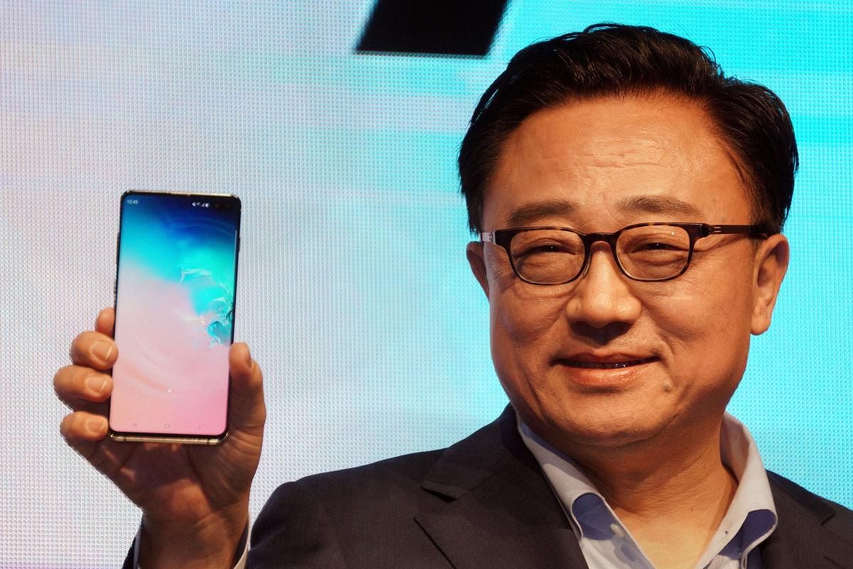 DJ Koh, president and CEO of IT &amp; Mobile Communications Division, Samsung Electronics, launches the new Samsung Galaxy S10+ mobile phone, at a press conference in New Delhi on Wednesday. (PTI Photo)