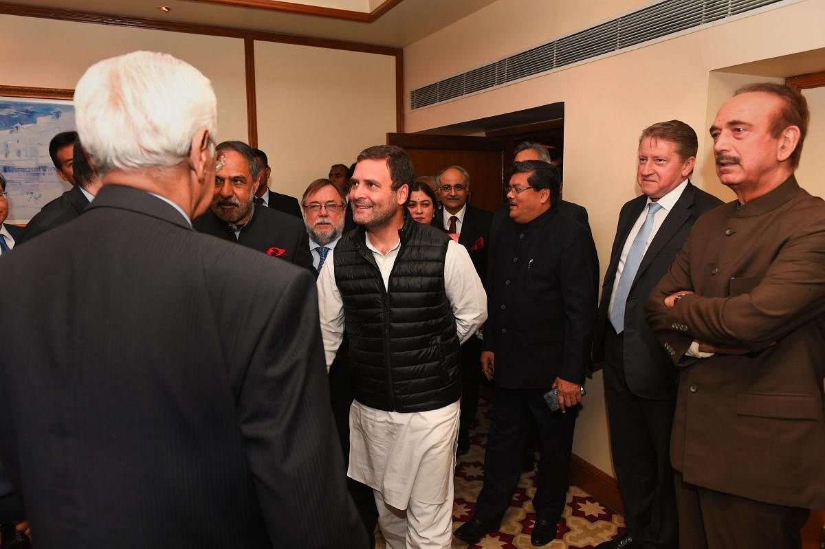 Congress President Rahul Gandhi greets the Ambassadors/High Commissioners of G-20 and neighbouring countries, during a meeting in New Delhi. PTI