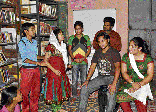 Members of the Chara community rehearse a drama in Ahmedabad.