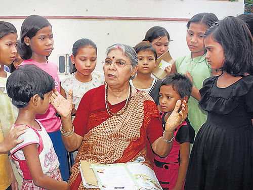 Sarojini Agarwal with adopted children.  DHNS