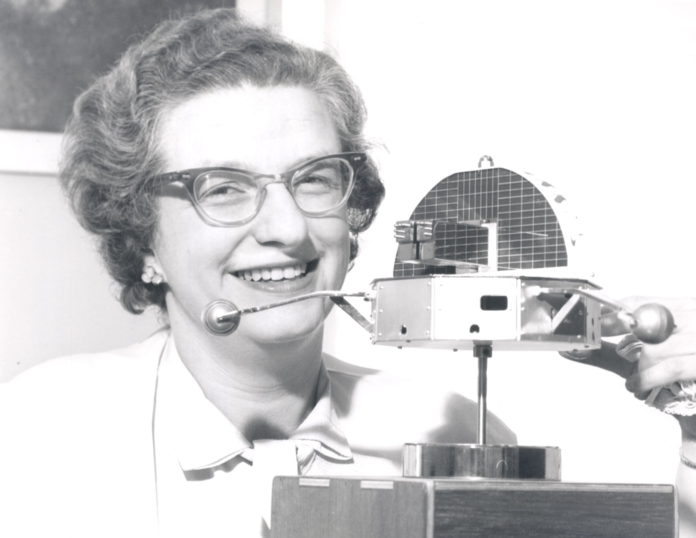 Dr Nancy Grace Roman with a model of the Orbiting Solar Observatory. Wikimedia Commons