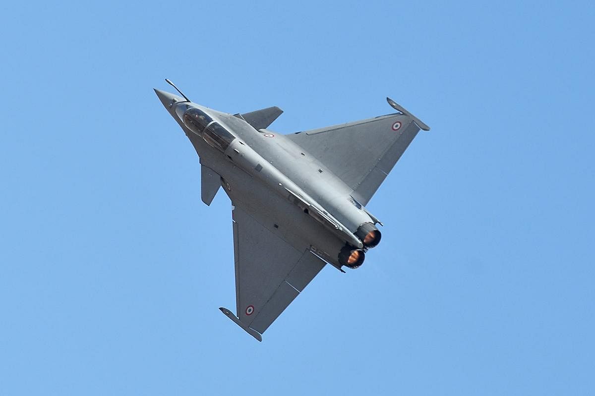 A Dassault's Rafale fighter jet performs a manoeuvre during a flying display on the inaugural day of the five-day Aero India 2019 airshow at the Yelahanka Air Force station, in Bengaluru. AFP