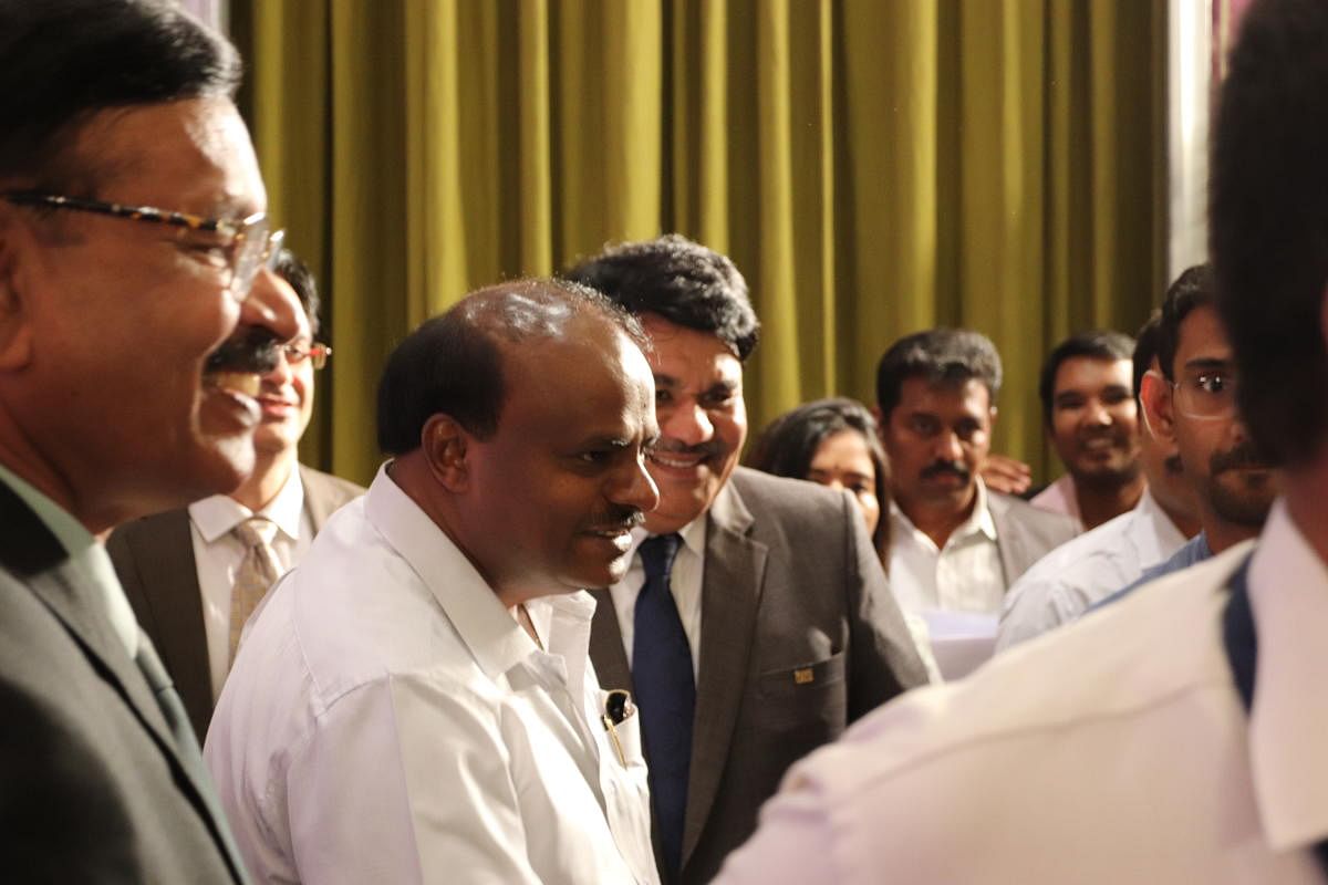 Chief Minister H.D. Kumaraswamy speaks to delegates during a summit held by the Confederation of Indian Industry (CII) at the Taj West End Hotel in Bengaluru on March 6, 2019. At the Chief Minister's left is Dr. N. Muthukumar, Chairmen of the CII.