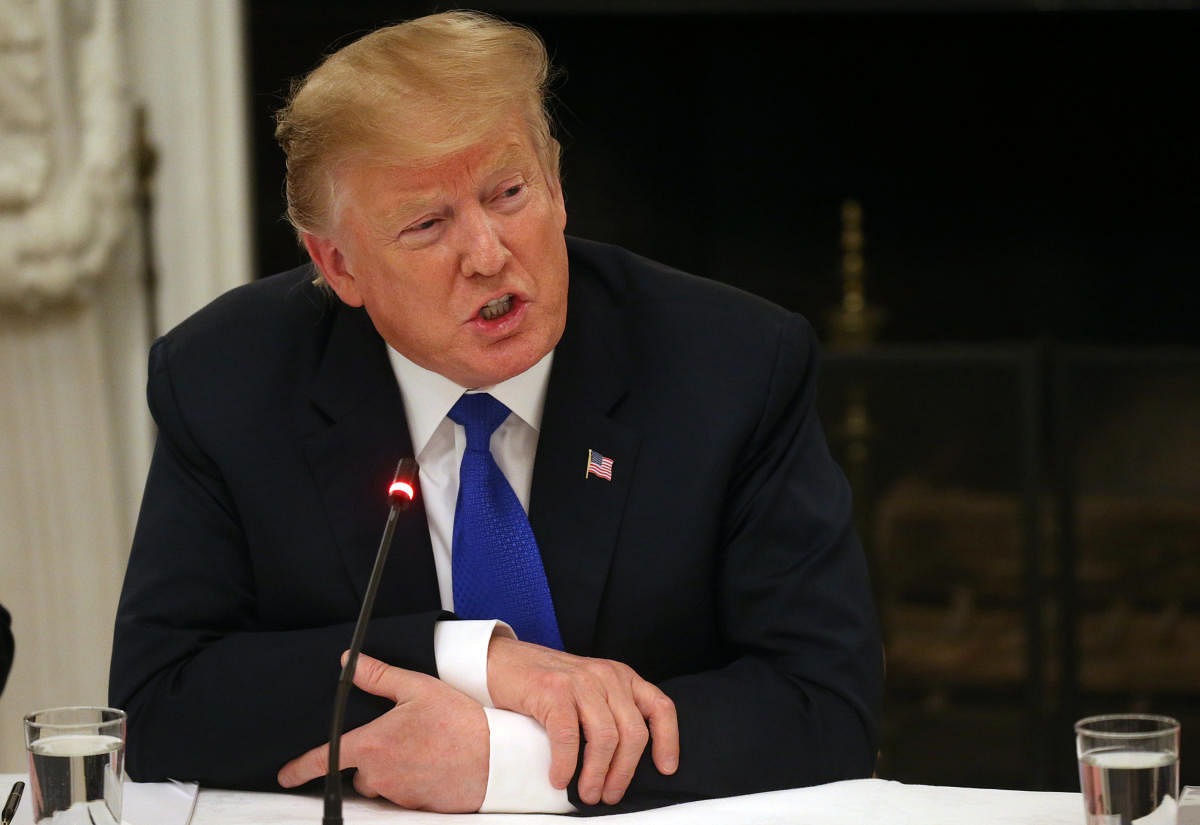 US President Donald Trump participates in an American Workforce Policy Advisory Board meeting in the White House State Dining Room in Washington, March 6, 2019. (REUTERS)