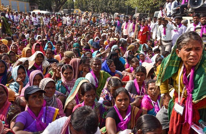 In this DH file photos, women from rural areas, who came from Chitradurga after a 12-day march, stage a protest on Sheshadri Road in Bengaluru demanding ban on the sale of liquor in the state. 