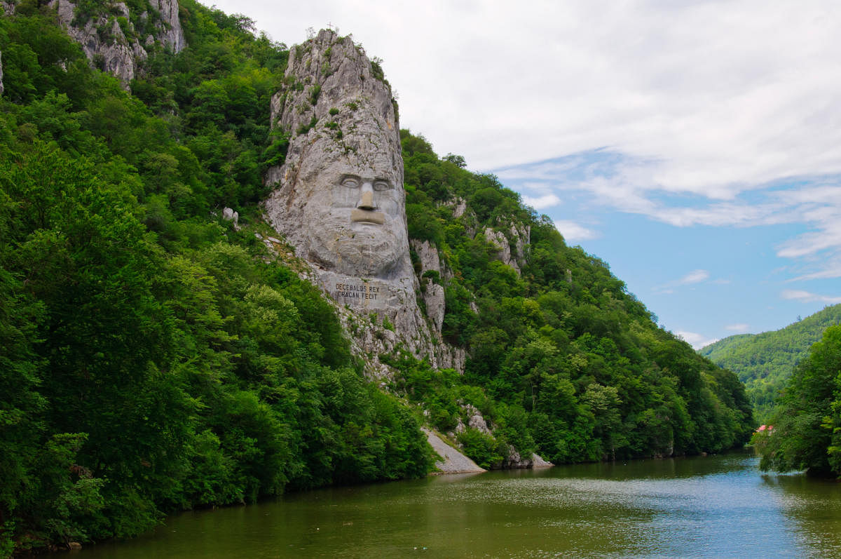 Carved portrait of Dacian king Decebal on Danube river.