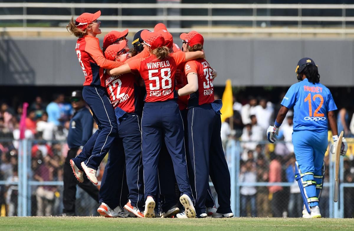 England's players celebrate after winning the final match of the women's Twenty20 (T20) cricket series between India and England at the Barsapara Cricket Stadium in Guwahati. AFP photo