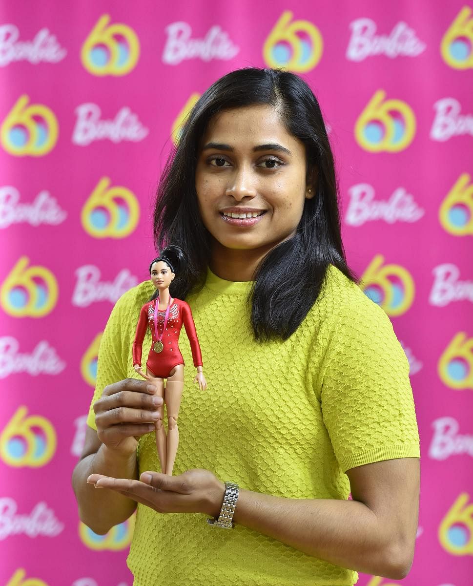 Star gymnast Dipa Karmakar with one-of-a-kind doll presented to her to commemorate Barbie's 60th anniversary in New Delhi on Saturday. PTI