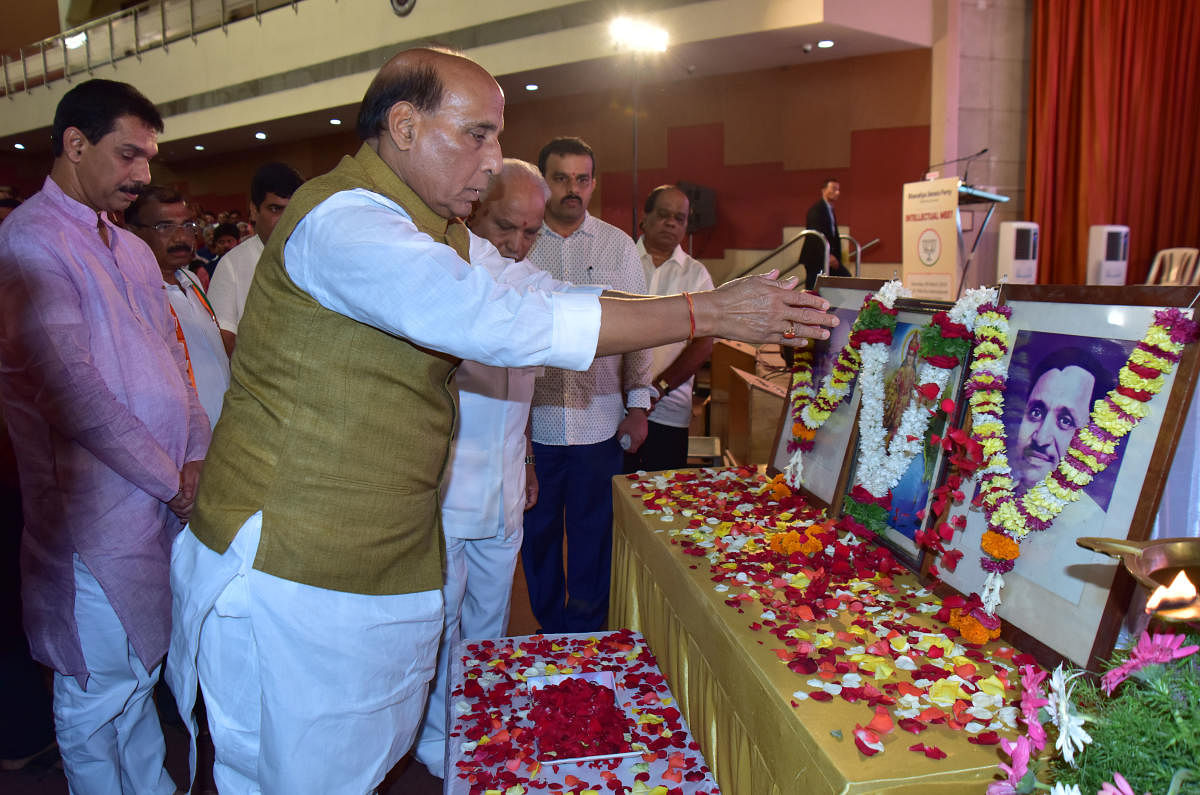 Union Home Minister Rajnath Singh offers floral tributes to Bharath Matha during the inauguration of intellectual meet at TMA Pai Hall in Mangaluru in Saturday.