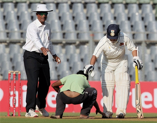 In the Ranji Trophy quarter-final against Baroda last season, a middle-aged man entered the Wankhede Stadium to touch Tendulkar's feet after he reached the three-figure mark. Photo: PTI