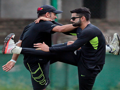 Test skipper Virat Kohli and limited overs captain Mahendra Singh Dhoni. AP File Photo