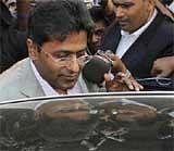 Indian Premier League (IPL) Chairman Lalit Modi prepares to enter a car after his arrival at the airport in Mumbai. AP