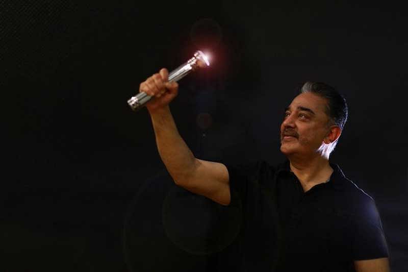 Kamal Haasan with his party symbol ' Battery Torch' (Picture: Makkal Needhi Maiam)