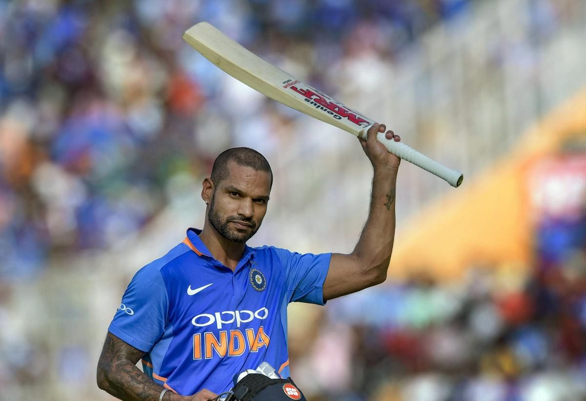  India's Shikhar Dhawan reacts as he returns after his dismissal on 143 during the 4th ODI cricket match against Australia in Mohali, Sunday. PTI photo