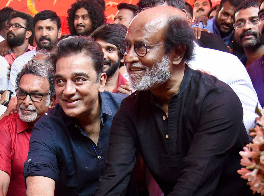 Tamil Super Stars Rajinikanth and Kamal Hassan during foundation stone laying ceremony of South Indian Film Artistes' Association building in Chennai on Friday. Actor M Nasar is also present. PTI file Photo
