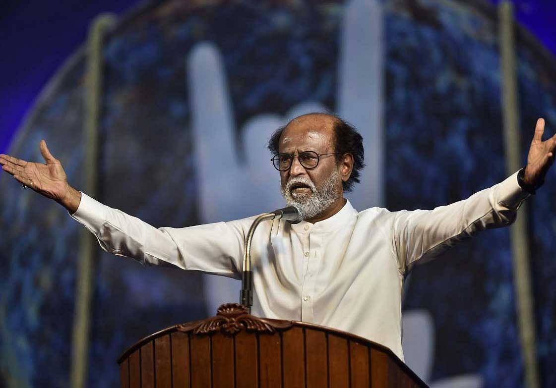 Tamil actor Rajinikanth gestures while announcing his political entry, on the final day of a six-day-long photo session with fans, in Chennai on Sunday. The announcement ended years of speculation about his joining of politics. PTI Photo
