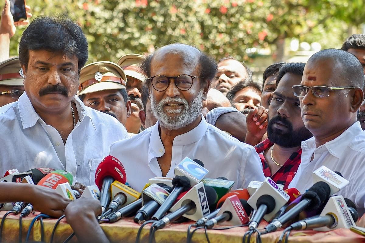 Actor-turned-politician Rajinikanth addresses the media after meeting DMDK chief Vijayakanth at his residence in Chennai onFriday. (PTI Photo)