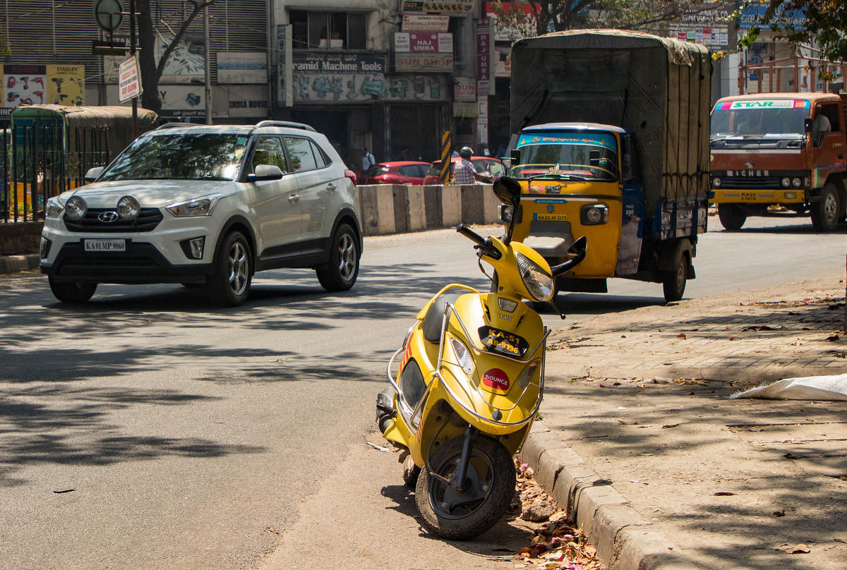 A bike taxi parked in a turn near the Corporation Circle in Bengaluru on Tuesday. DH Photo/Sudheesha K G