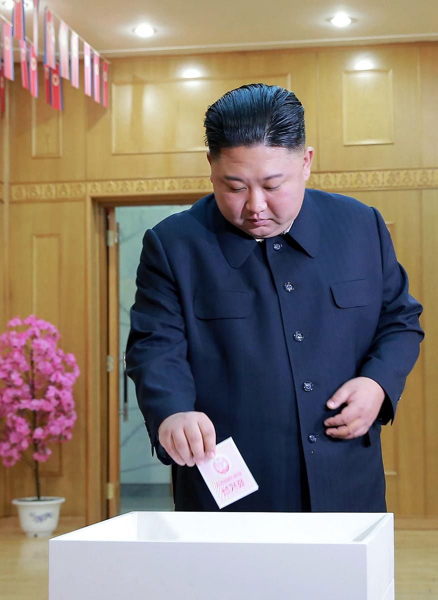 In this picture taken on March 10, 2019 and released from North Korea's official Korean Central News Agency (KCNA), North Korean leader Kim Jong-Un casts his ballot for the Supreme People's Assembly elections, at a polling station in Kim Chaek University
