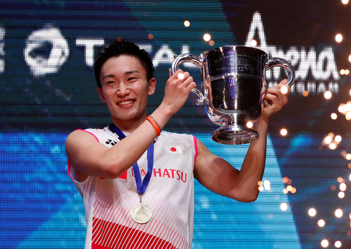Japan's Kento Momota celebrates with the All England championship trophy after winning men's final against Denmark's Viktor Axelsen. Reuters