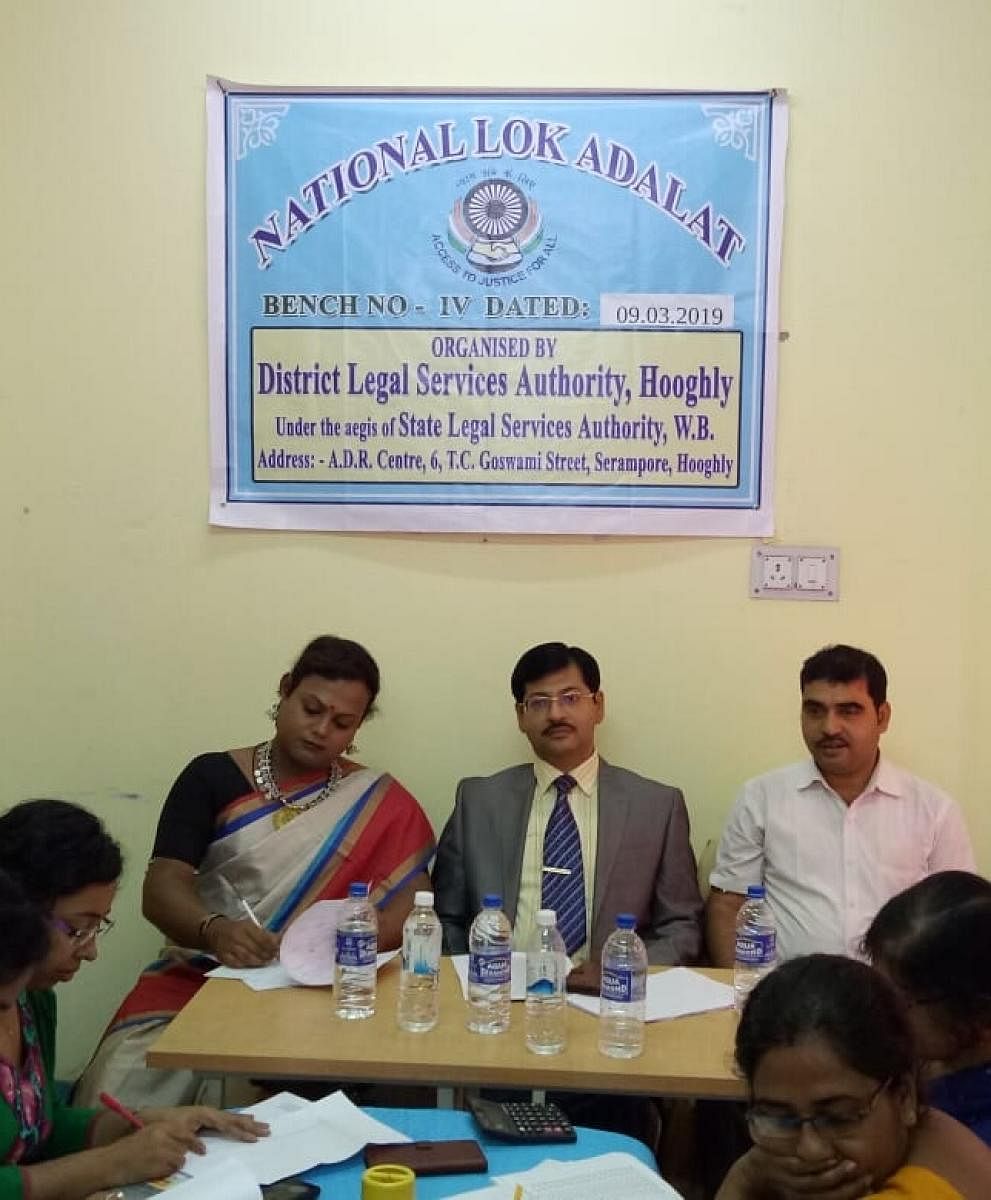 Shintu Baghui ( extreme left) at the recently held Lok Adalat in Hooghly district. DH Photo