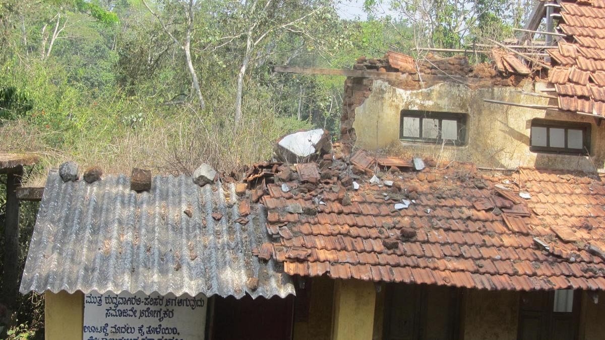 The roof and walls of a building on the premises of the Government Model Primary School in Napoklu have already collapsed.