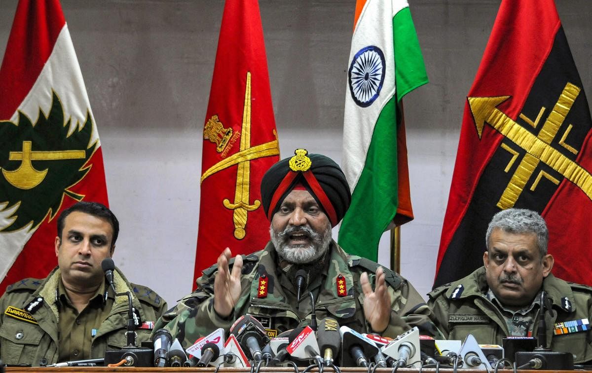 Srinagar: Indian Army's Lt General KJS Dhillon, Inspector General of Police Kashmir S P Pani (L) and CRPF Inspector General Kashmir Zulfiqar Hassan (R) address a joint press conference at Army's 15 Corps headquarters, Badami Bagh in Srinagar, Monday, Marc